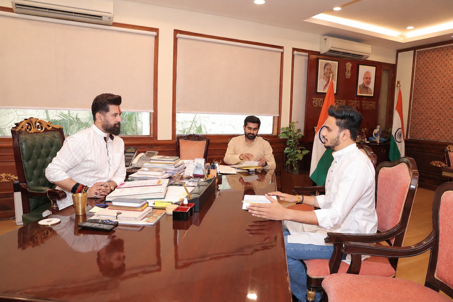 Dibyesh Pandey in a formal office discussion