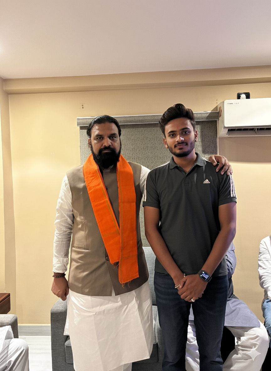Dibyesh Pandey standing with a political leader